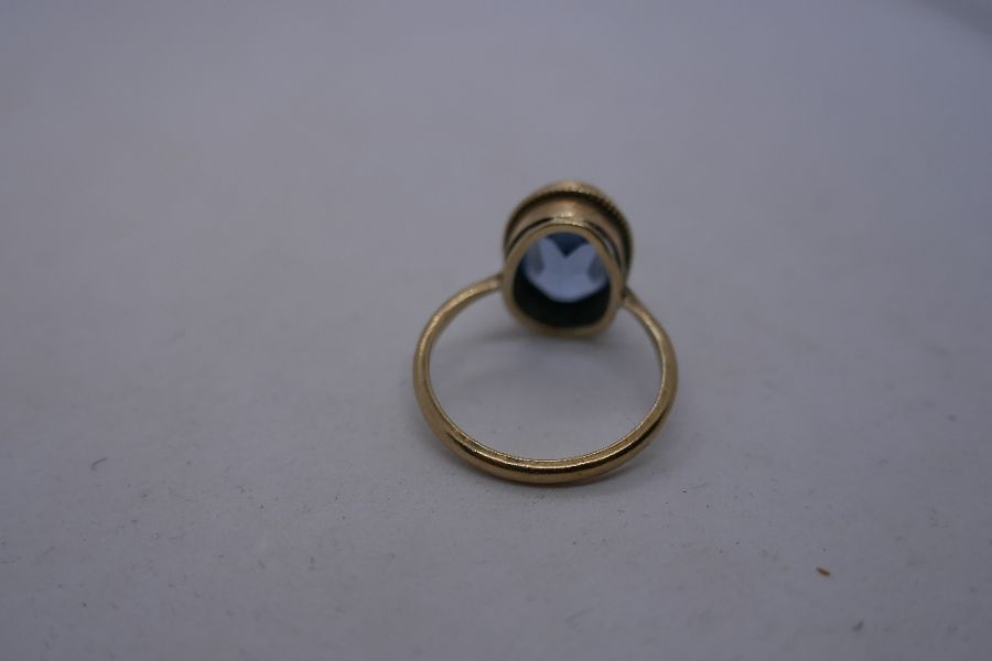 9ct yellow gold dress ring set with oval pale blue stone, marked 375, size R, 4.1g approx - Image 2 of 8