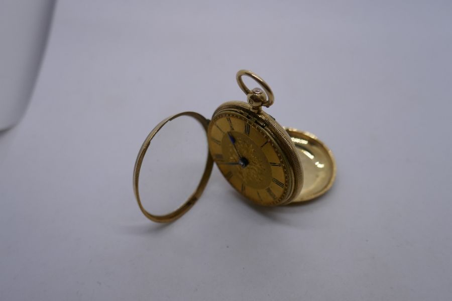 18ct yellow gold ladies fob watch with decorative engraved face, maker J Bell, London, number 16007,