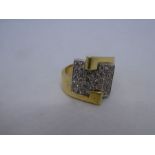 Art Deco design crossover yellow gold crossover design ring with central rectangular panel set appro