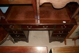 Mahogany pedestal desk with tooled brown leather and 9 drawers