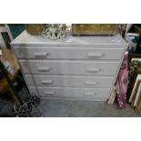 A mid 20th century painted chest having four long drawers