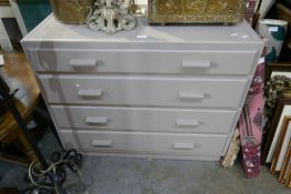 A mid 20th century painted chest having four long drawers