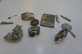 A silver lot comprising silver trinket boxes, silver and Mother of Pearl penknives, small silver bac