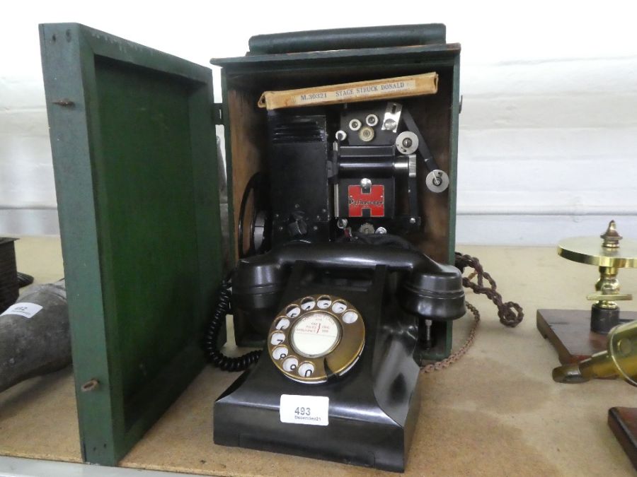 A vintage Bakelite light telephone and a panthascope projector in case