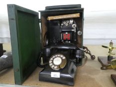 A vintage Bakelite light telephone and a panthascope projector in case