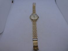 Vintage 9ct yellow gold Garrard wristwatch with champagne face and 9ct yellow gold strap in GARRDARD