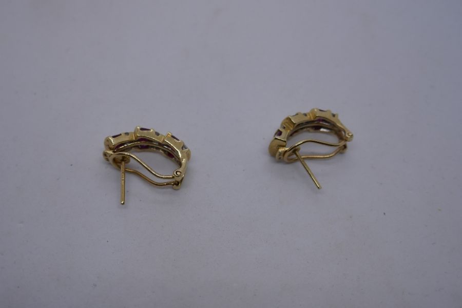 Pair of modern 14K yellow gold scalloped design stud earrings set with baguette cut rubies, separate - Image 4 of 8