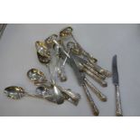 A quantity of various mixed cutlery to include silver spoons, a set of six silver handled knives, et