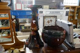 A brown glazed Jardinière and pedestal decorated flowers