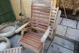 Two teak garden reclining armchairs and two tables by Swan, Hattersley