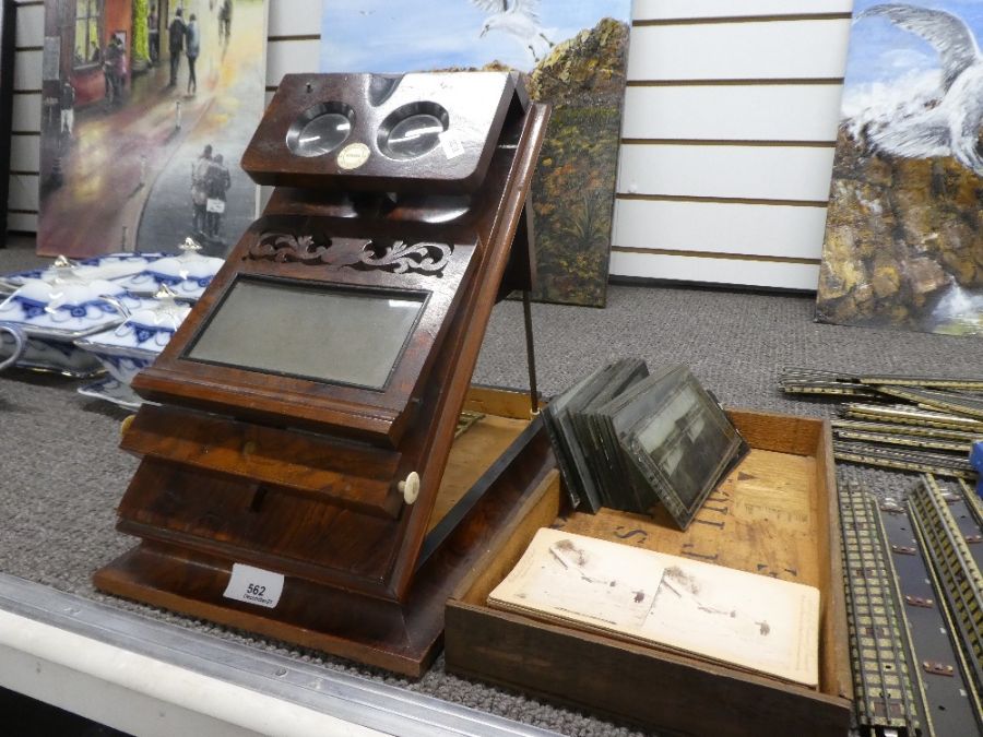 A Victorian Walnut Stereoscopic viewer by Rosell's and a quantity of glass & card photographs of Nia