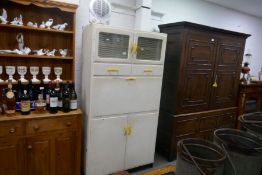 A vintage probably 1950s painted kitchen cabinet having drop flap with enamel worktop