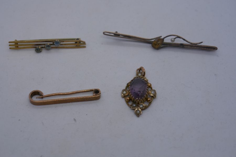 Three 9ct gold bar brooches, one set with pale blue stones, one with a pear shaped citrine and anoth