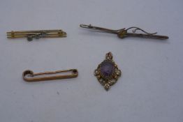 Three 9ct gold bar brooches, one set with pale blue stones, one with a pear shaped citrine and anoth