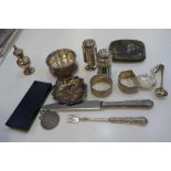 A mixed silver lot comprising peppers, napkin rings, cigarette case, trinket dishes, etc and a Victo