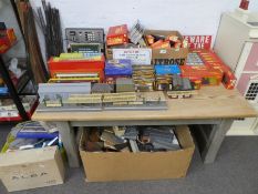 A large quantity of OO gauge boxed rolling stock, control unit and other related accessories and tra