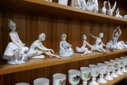 A quantity of Lladro and Nao ballerina figures, a set of 3 Lladro cranes and 2 other figures