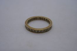 18ct yellow gold eternity ring set with clear stones, marked 18ct, size P 3.1g