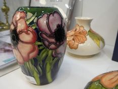 Moorcroft, a small floral vase, 2002, 13.5cm and a Moorcroft squat vase, cream with orange flowers