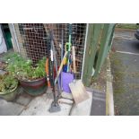 Collection of garden tools, saws, spade etc