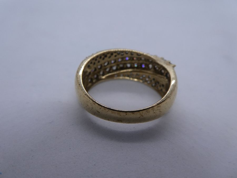9ct yellow gold diamond crossover ring with 26 0.05 carat diamonds on the raised cross over, and dia - Image 3 of 4