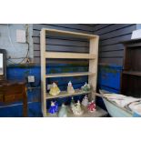 A cream painted kitchen dresser with open rack above 2 drawers and dressers