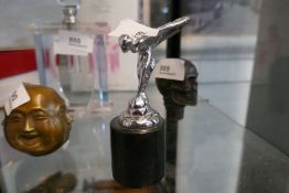 Spirit of Ecstasy on granite