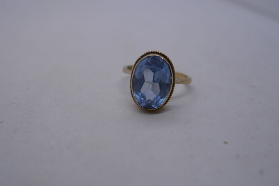 9ct yellow gold dress ring set with oval pale blue stone, marked 375, size R, 4.1g approx - Image 5 of 8