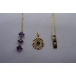 9ct gold neckchain hung with a sapphire and diamond chip pendant, 9ct fine gold neckchain hung with