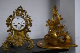 A French gilt metal mantle clock having scroll decoration