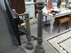 Two similar antique style candlesticks having fixed columns