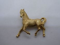 14K yellow gold brooch in the form of a stallion, marked 14K, 13.7g
