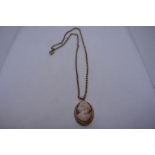 Unmarked yellow metal belcher chain 8.1g, hung with a 9ct gold mounted cameo pendant