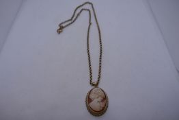 Unmarked yellow metal belcher chain 8.1g, hung with a 9ct gold mounted cameo pendant