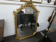 An antique gilt wall mirror the surmount decorated flowers & scrolls, 75cm