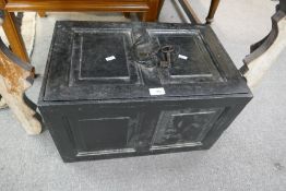 An antique cast iron strongbox with key