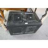 An antique cast iron strongbox with key