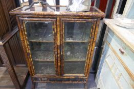 Victorian bamboo display cabinet having 2 glazed doors with lacquer top