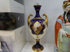 A 19th century Coalport Vase having gilt decoration with painted oval panel of landscape scene