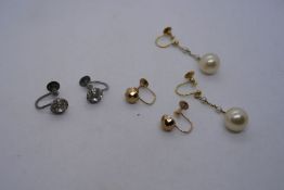 Two pairs of 9ct screw back earrings and a silver pair