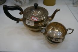 WITHDRAWN A silver tea pot hallmarked Birmingham 1932 G Bryan and Co. Also with a matching