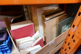 A selection of pictures and prints books etc in a wooden crate