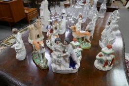 A quantity of Staffordshire flat back figures and similar