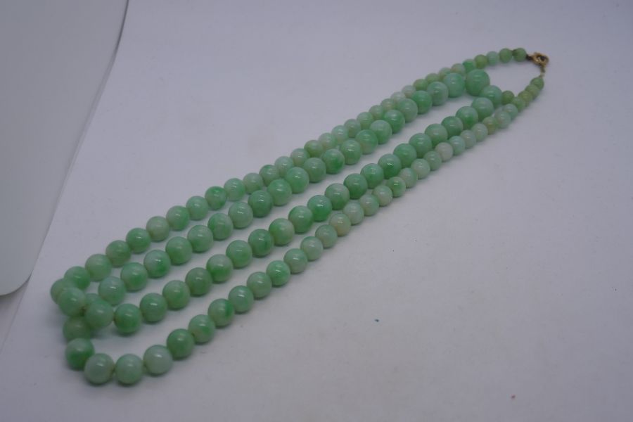 Long string of vintage pale green Jade beads with 9ct yellow gold clasp, together with another Jade