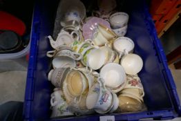A box of china cups including Wedgwood etc