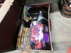 Large amount of 60's/70's Vinyl single records in two old suitcases and bundle of company sleeves