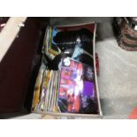 Large amount of 60's/70's Vinyl single records in two old suitcases and bundle of company sleeves