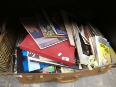 Case records, comics and basket of ephemera and a case of records