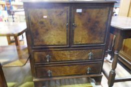 A mahogany two tier table, the top inlaid star and a reproduction cupboard having two drawers