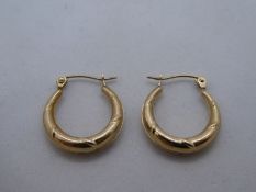 Pair of 9ct yellow gold creole earrings marked 375. approx .7g